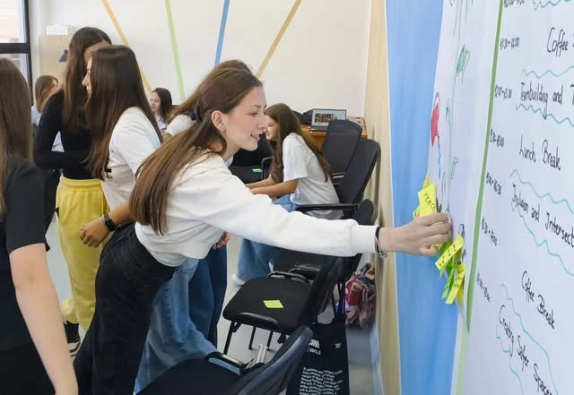 RinON participants sharing ideas on a wall during a workshop